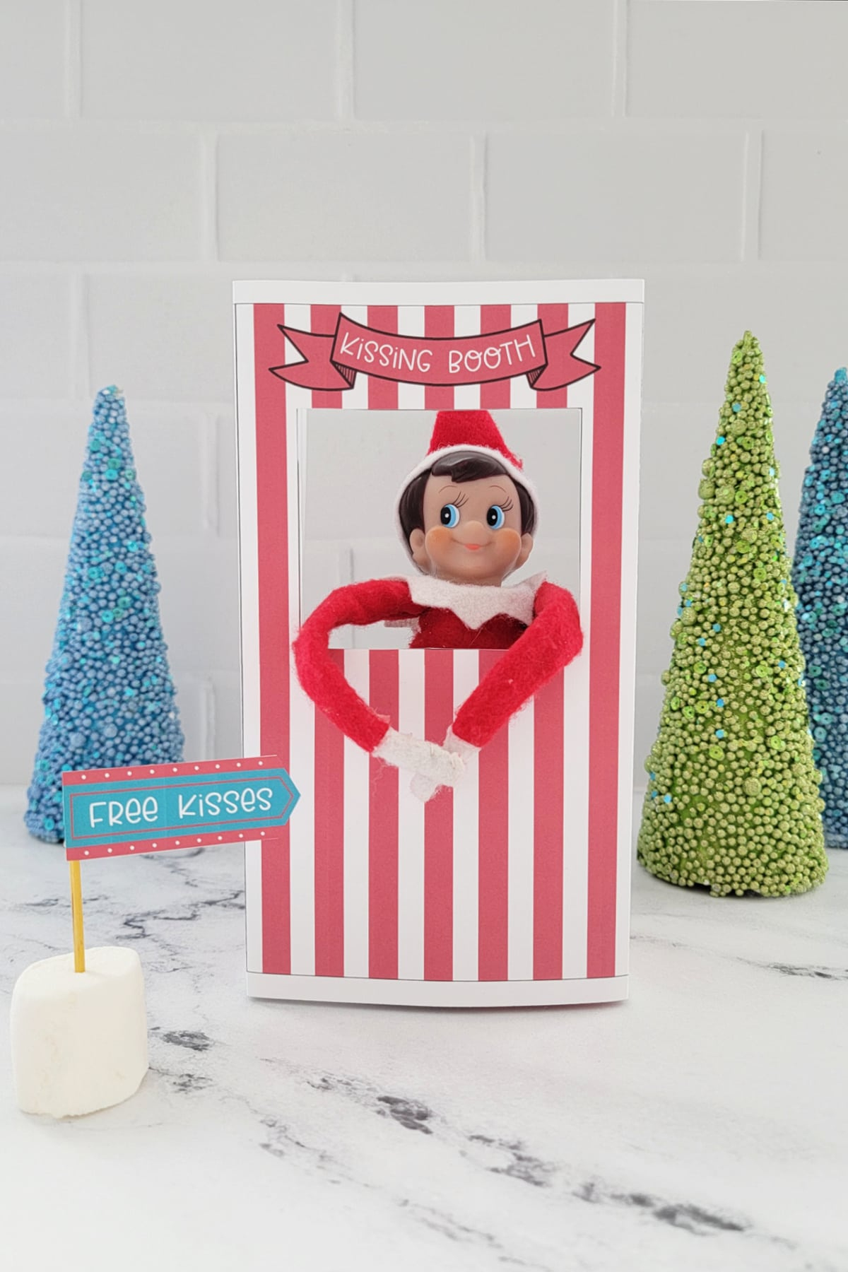 Elf On The Shelf Kissing Booth (Free Printable) - Fun Money Mom throughout Elf On The Shelf Kissing Booth Free Printable